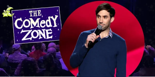 Michael Palascak, the featured comedian, on stage with a mic, promoting The Comedy Zone series.