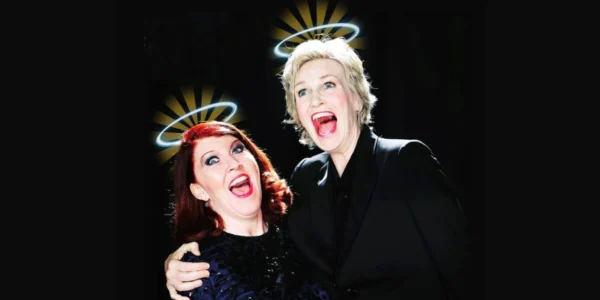 Jane Lynch and Kate Flannery with halos, mouths open in a comedic expression. For 