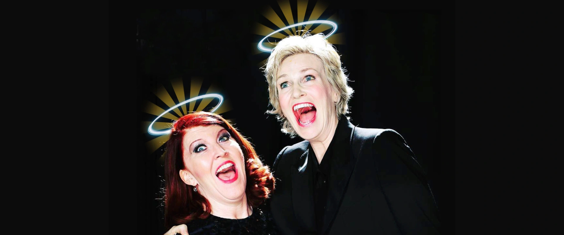 Jane Lynch and Kate Flannery with halos, mouths open in a comedic expression. For 