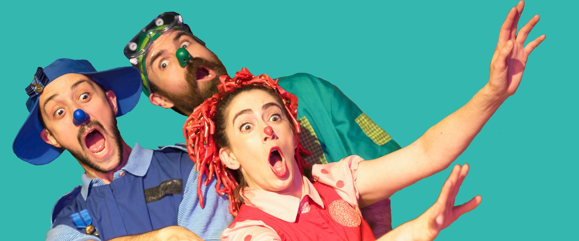 Three performers in colorful, whimsical costumes and clown noses with exaggerated, surprised expressions. On page for Yellow Bird Chase.
