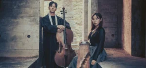Photo: woman in black dress with a gayageum and man with a cello posed together