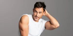 Photo: studio headshot of Cheyenne Jackson gazing into camera